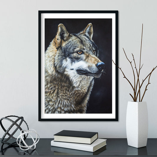 Image of a wolf portrait painting in a black frame on a white wall