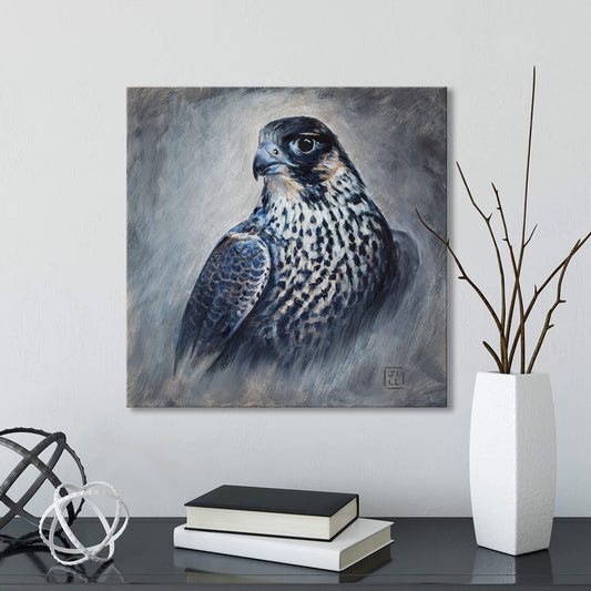 Painting of a peregine falcon on a wall above a table with books and decorative items.