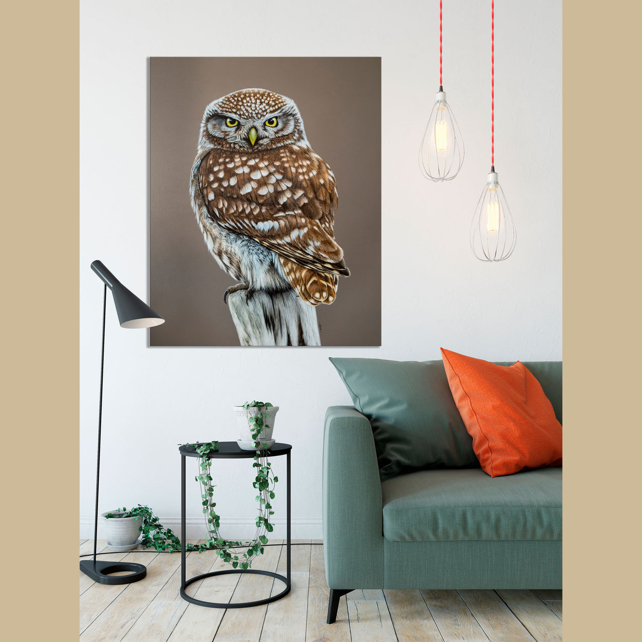Painting of a little owl on a canvas on a white wall in a room with a sofa, table and lamps